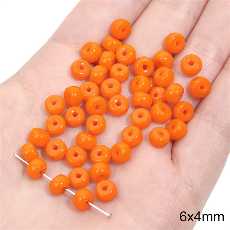 11:Solid color small pier bead 6x 4mm aperture about 1mm orange