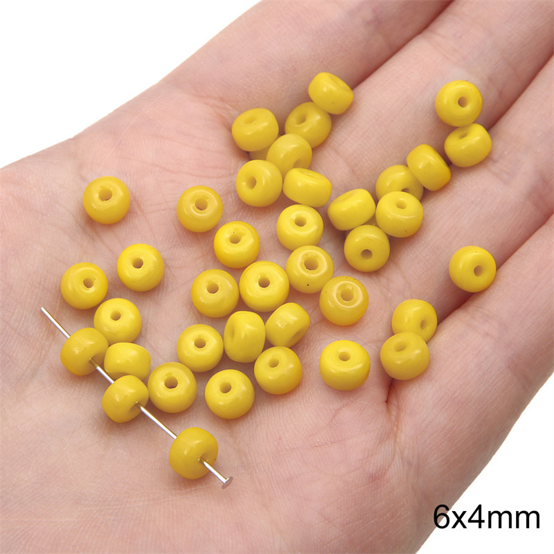 12:Solid color small pier bead 6x 4mm aperture about 1mm yellow