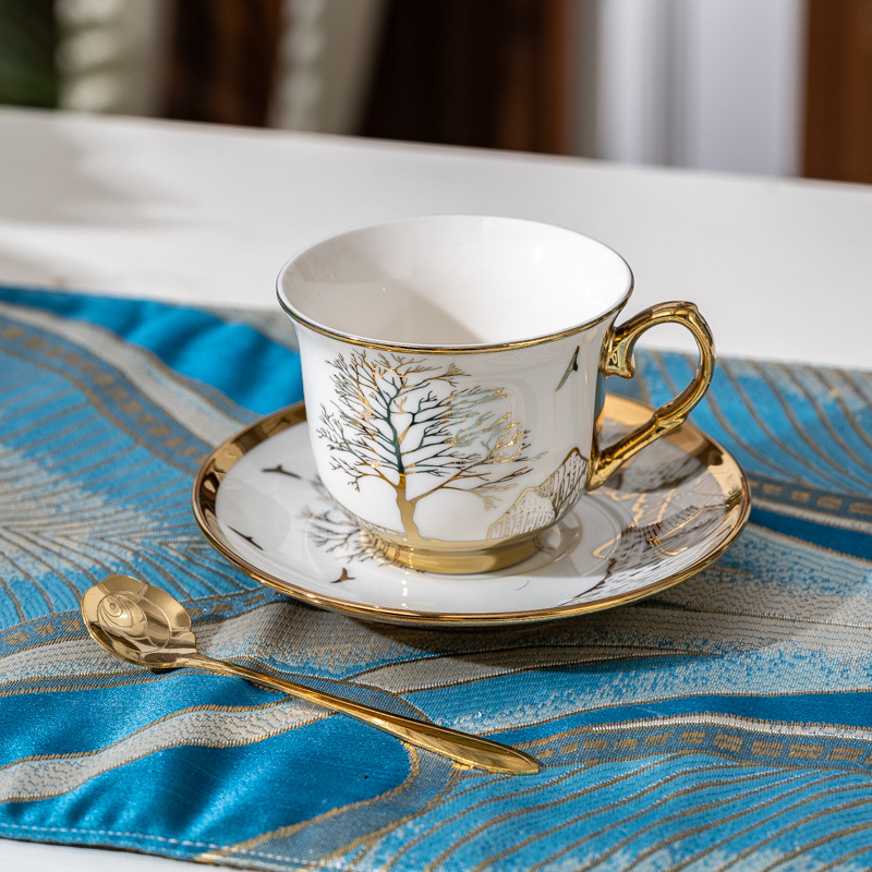 1 cup and 1 plate of gold spoon