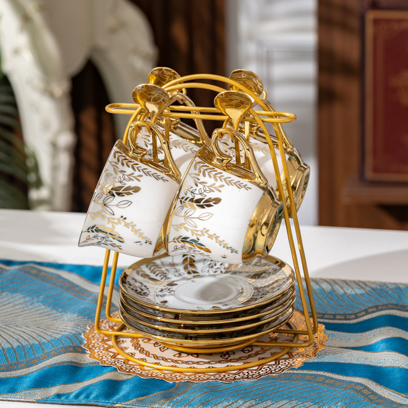 Four cups, four plates and four spoons of golden branches and jade leaves