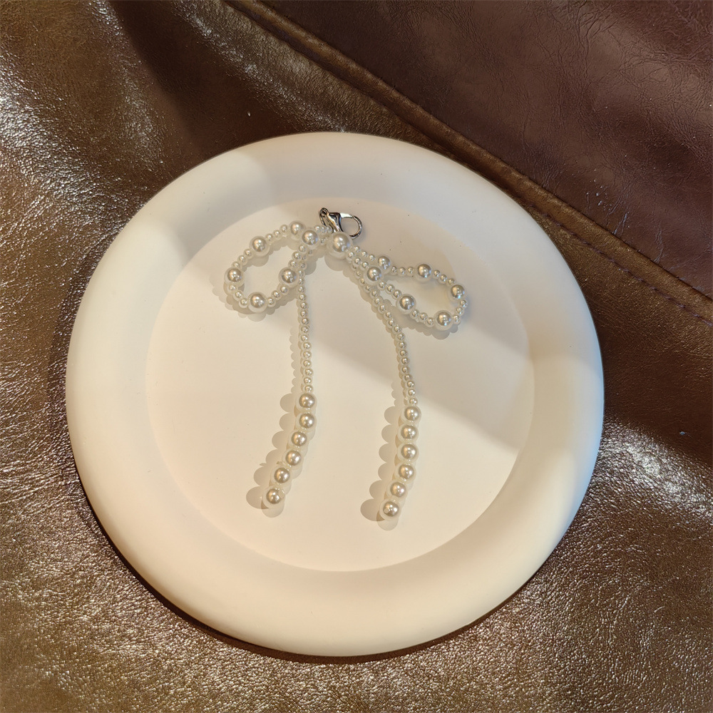 14:Big and small pearls spaced bow shoe flower string