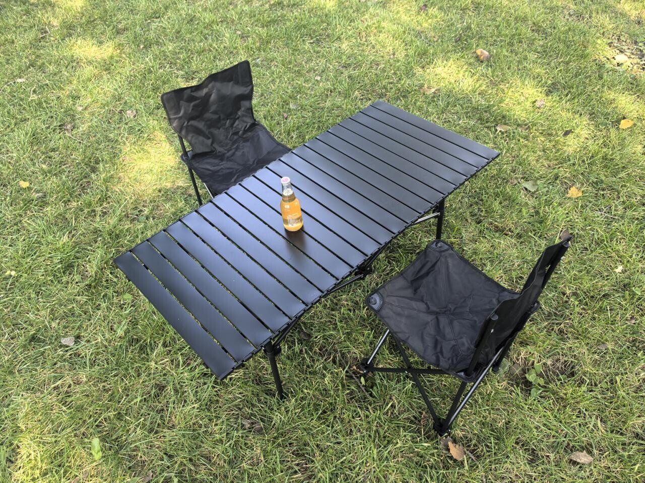 Frosted black 120cm long table and 2 black folding chairs