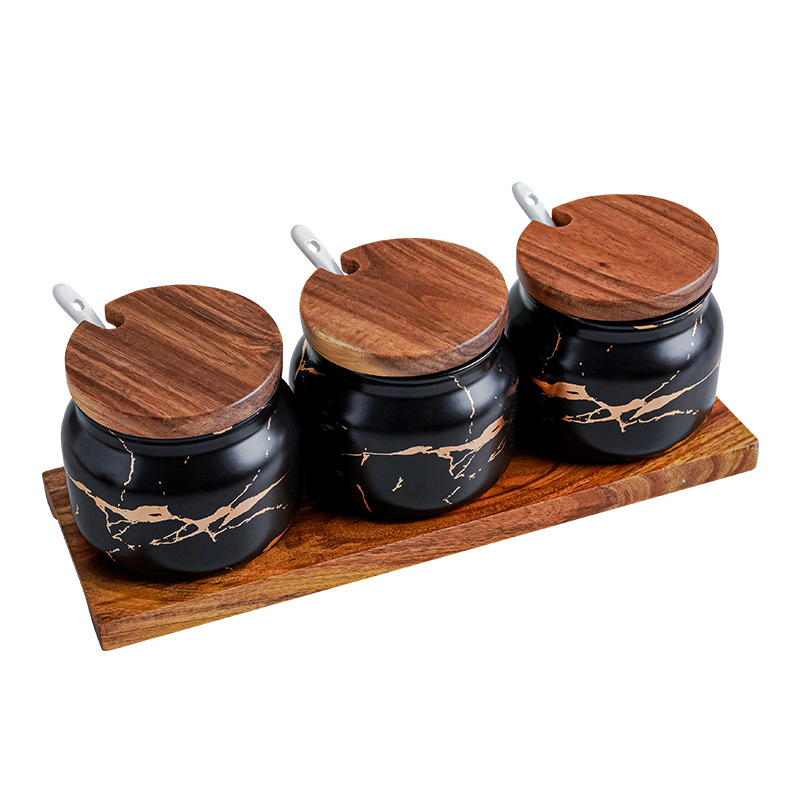 Set of three matte black marble gold round seasoning jar with ceramic spoon and wooden holder