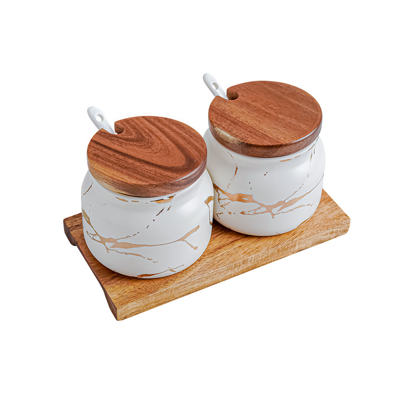Set of two matte white marble gold round seasoning jar with ceramic spoon and wooden holder