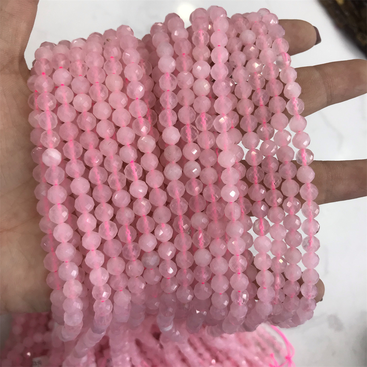 08-5mm rose quartz 5-6mm faceted round beads, one