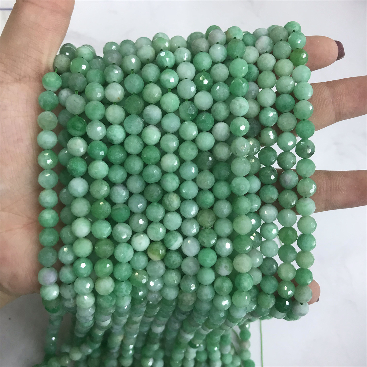 13-6mm emerald 5-6mm faceted round beads, one piec