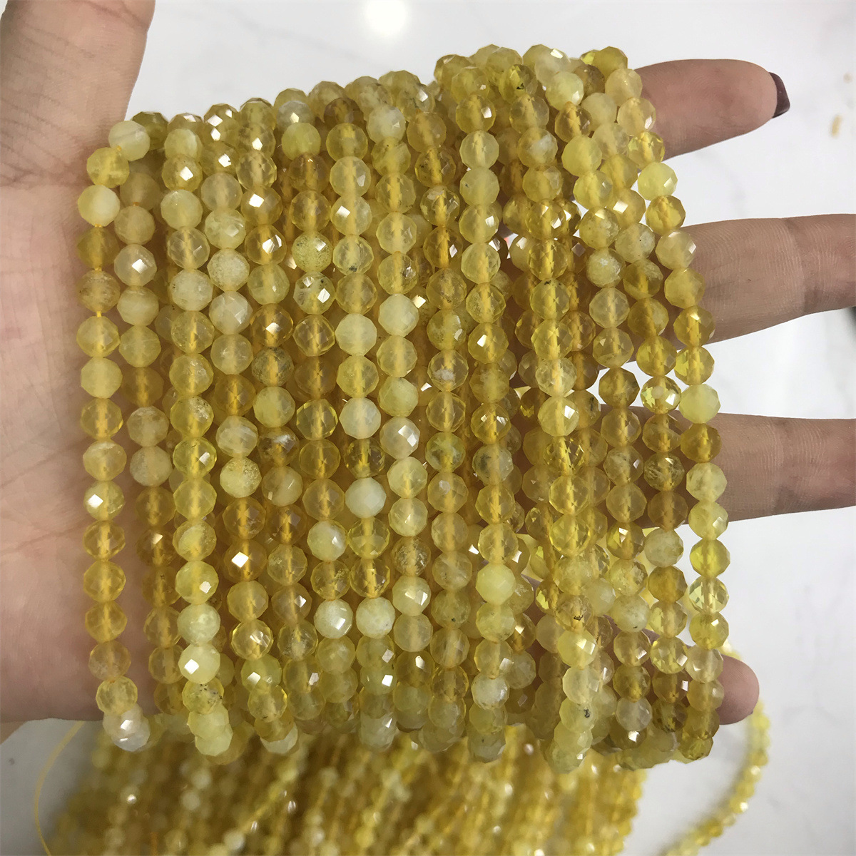 17-5mm yellow opal 5-6mm faceted round beads, one
