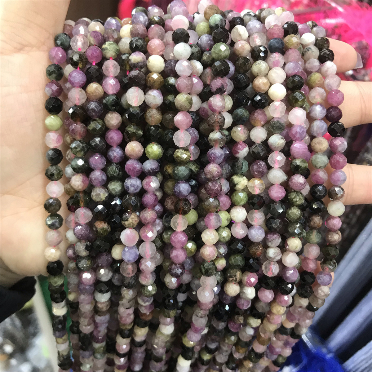 28-5mm tourmaline 5-6mm faceted round beads, one p