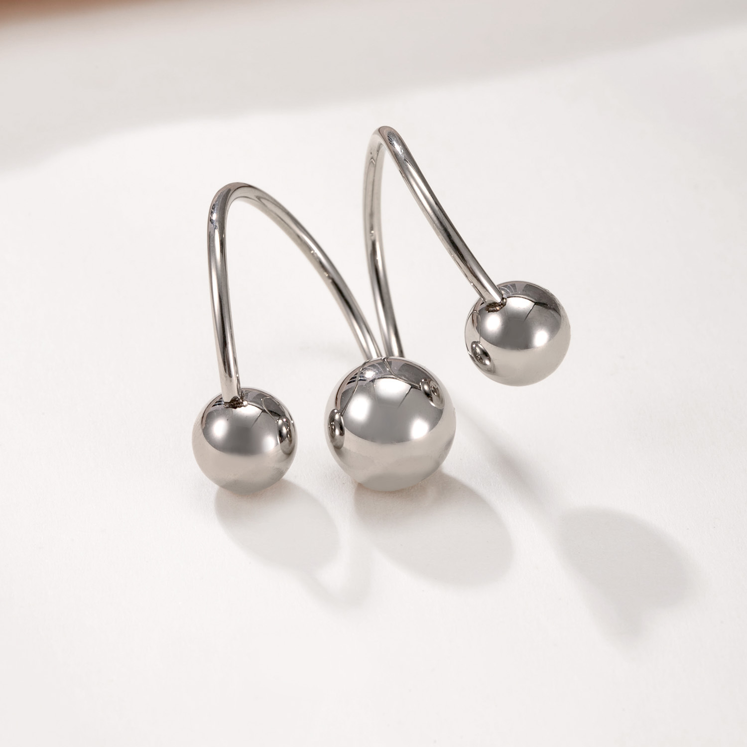 1:Three steel colored balls