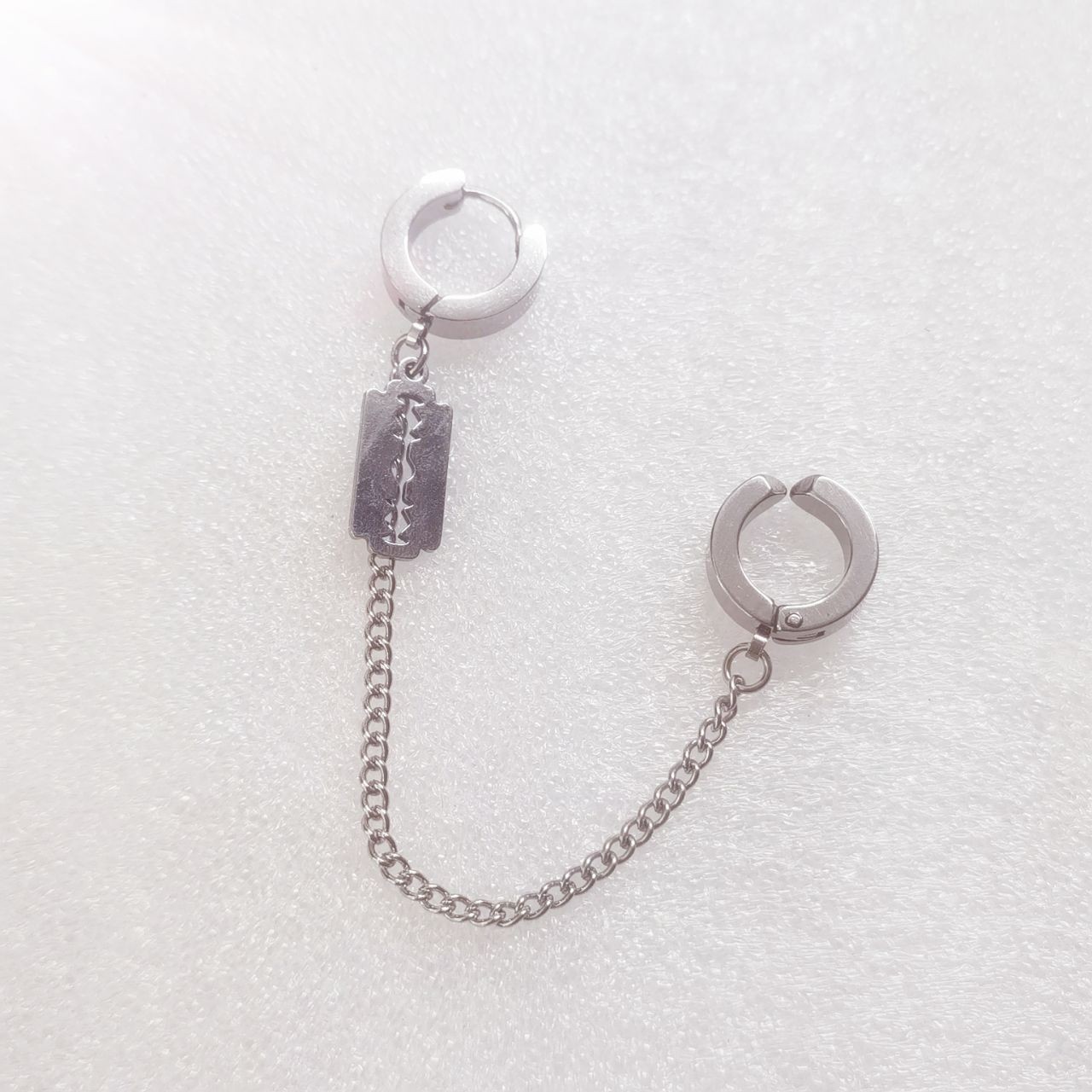 Steel-colored earring blades are available in ear