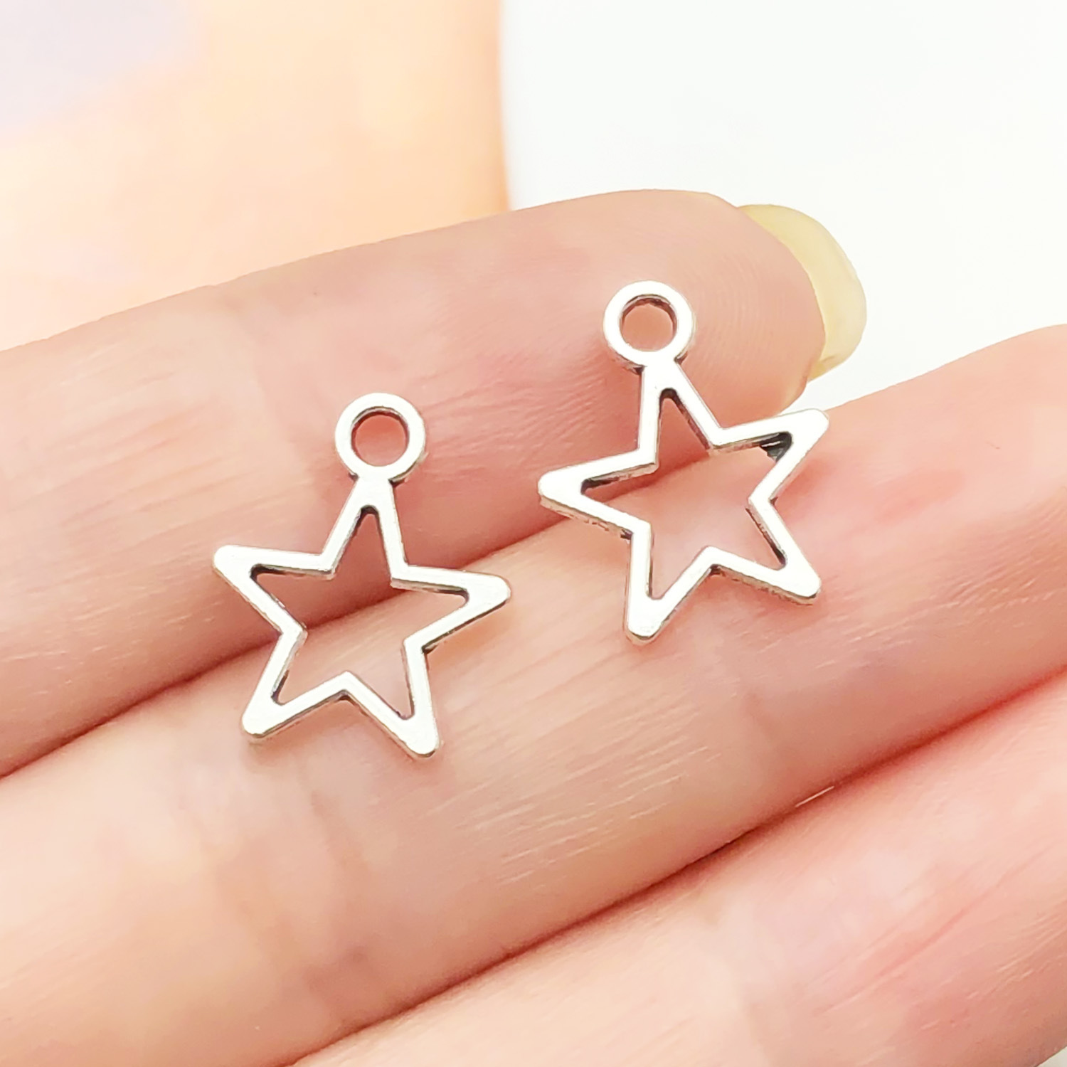16:22344-1 thin antique silver zinc alloy star 14x12mm-0.35g