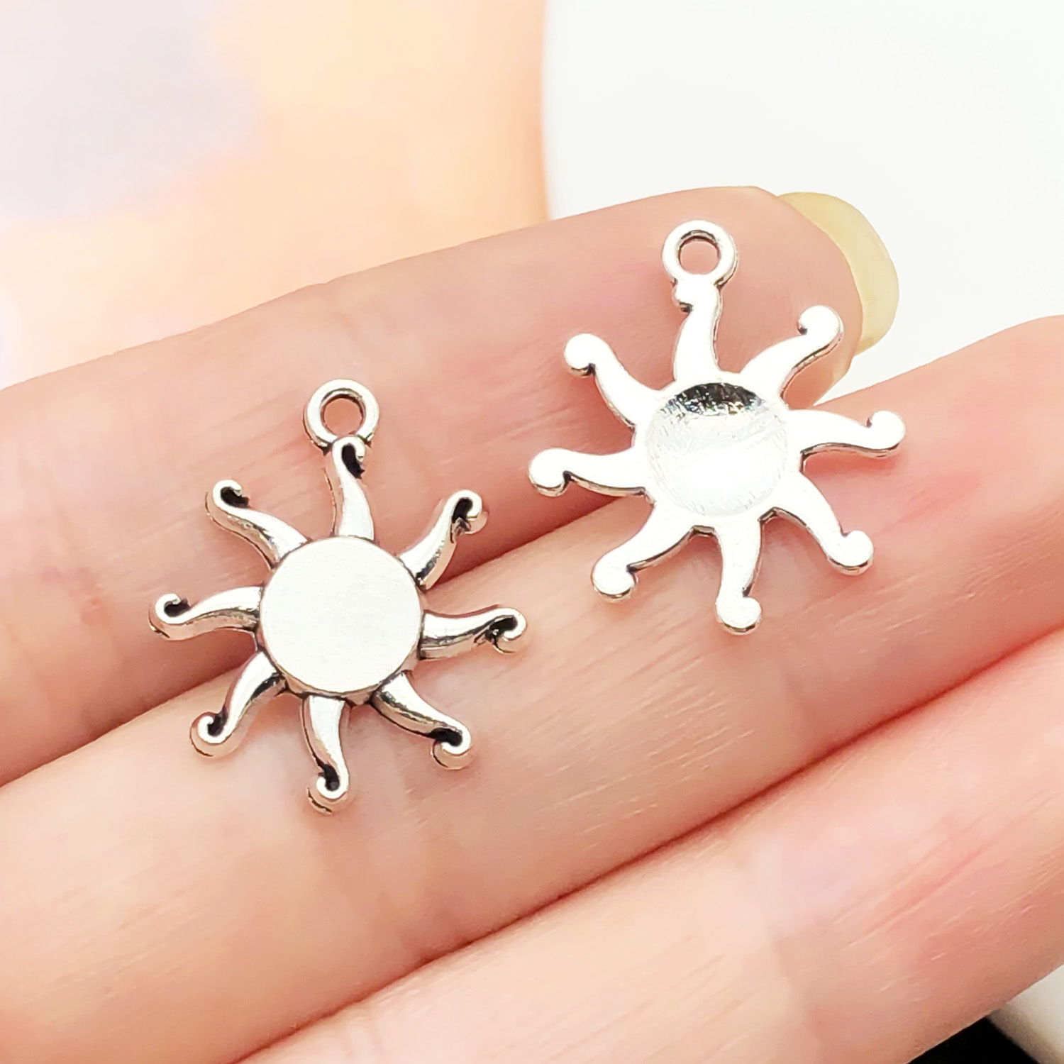 20:7699-1 ancient silver zinc alloy sun 16x19-0.9g