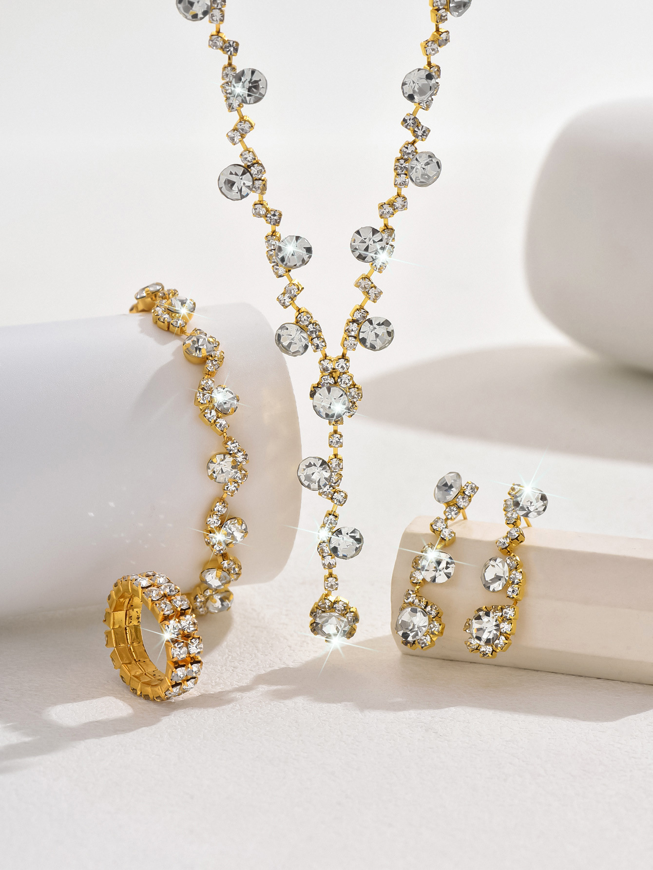 1:A gold necklace earrings bracelet ring 2 rows