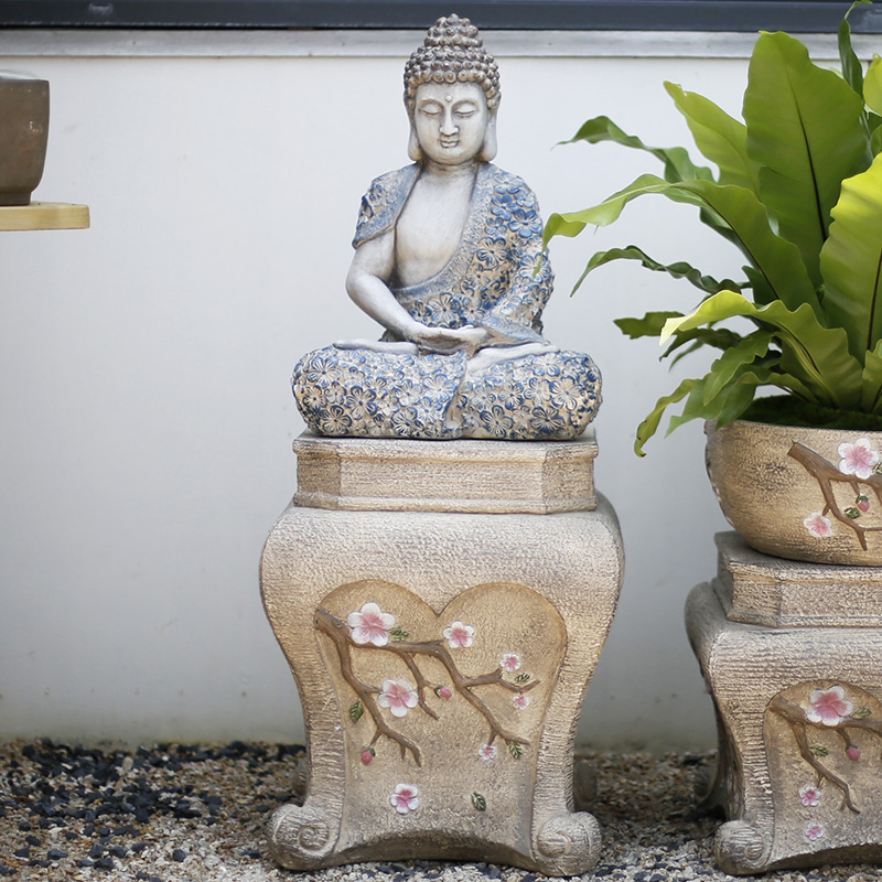 Sitting Buddha sand color stone pedestal