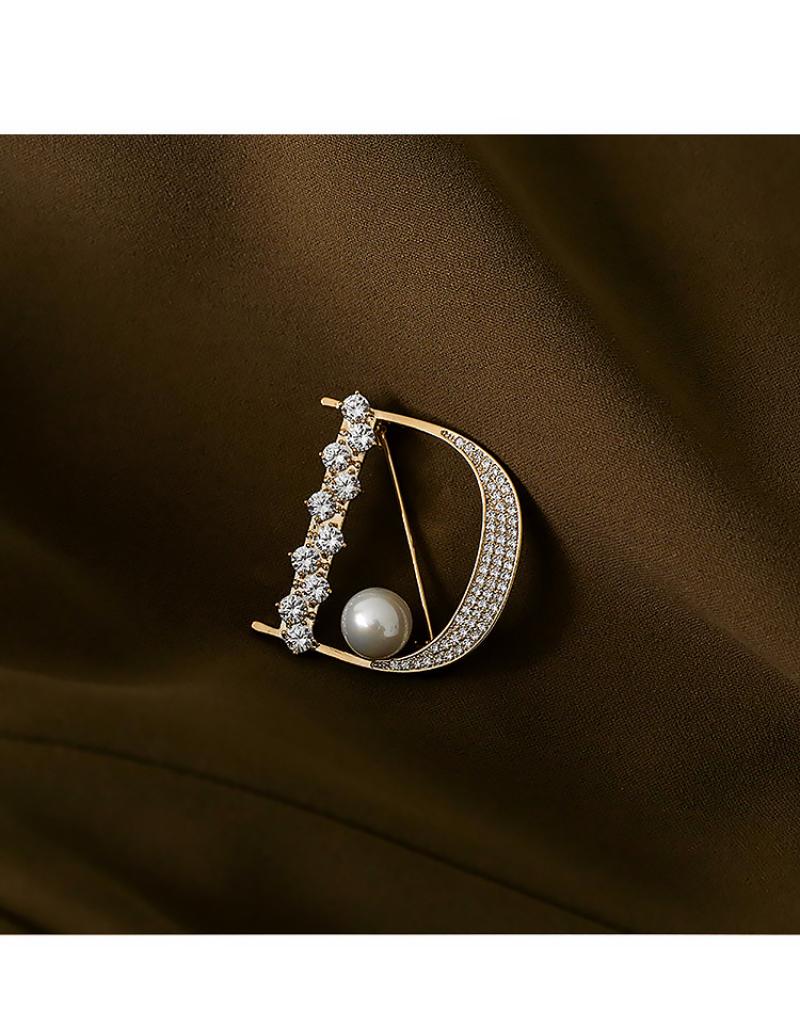 1:D-word brooch gold