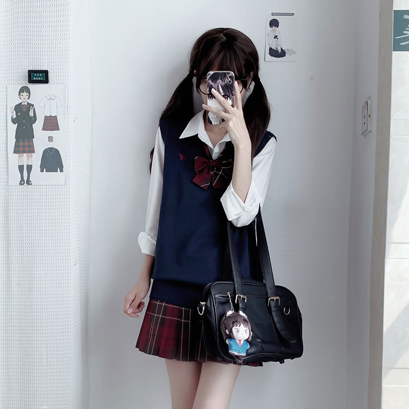 Navy blue vest + red plaid skirt + long-sleeved shirt + bow tie