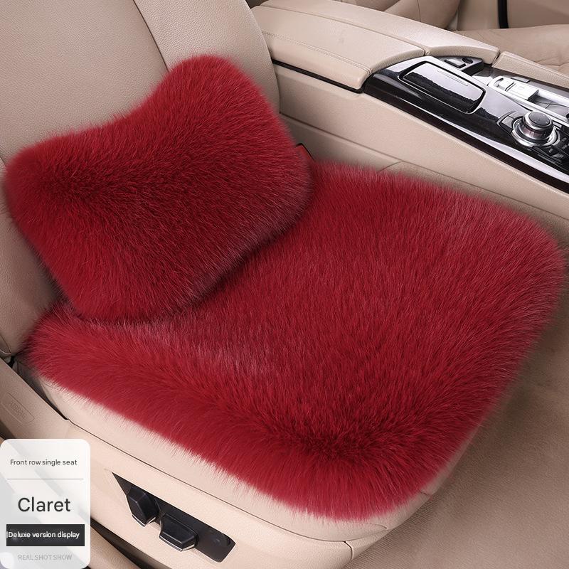 A burgundy single seat   waist pillow