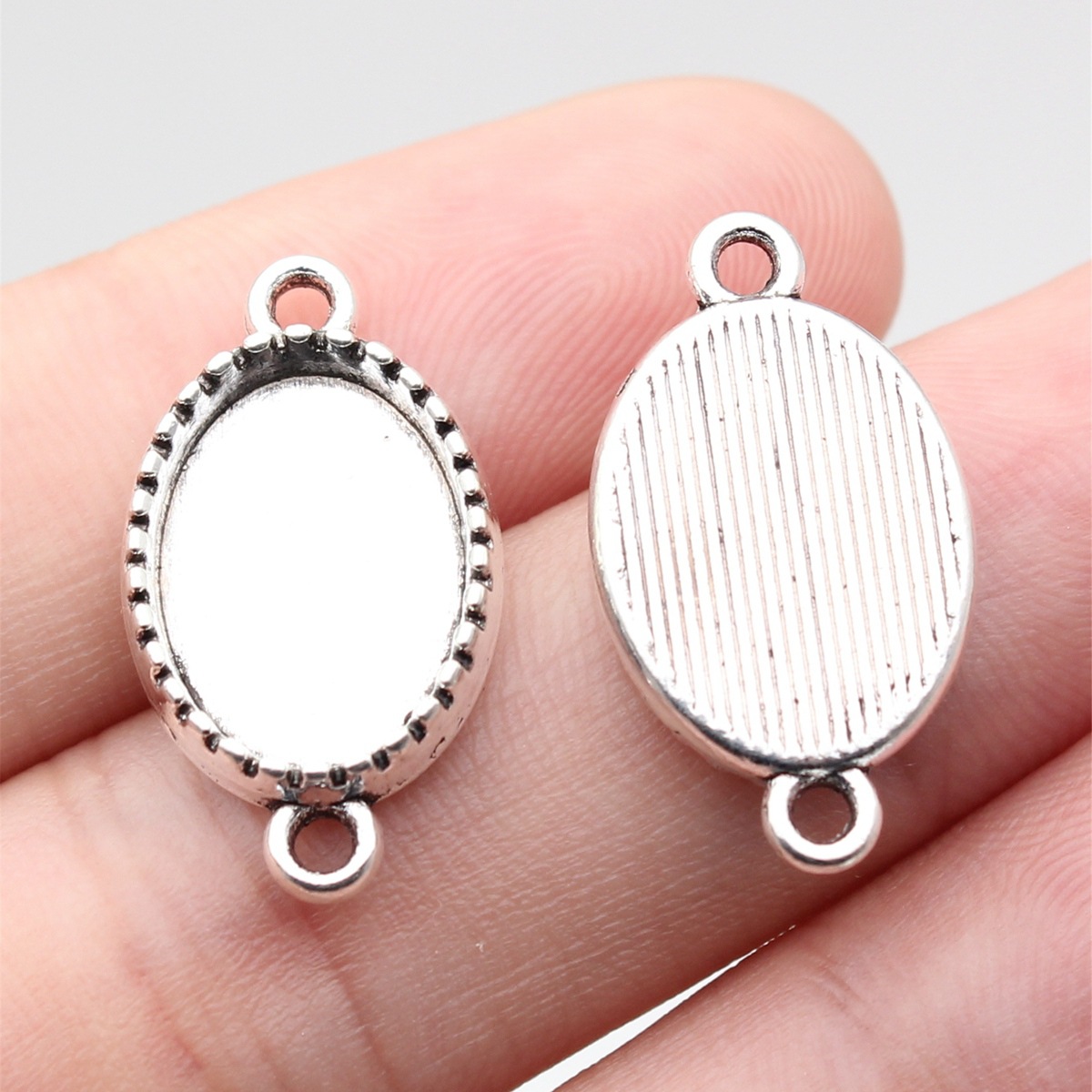 Outer diameter: 23x13mm, inner diameter: 10x14mm -