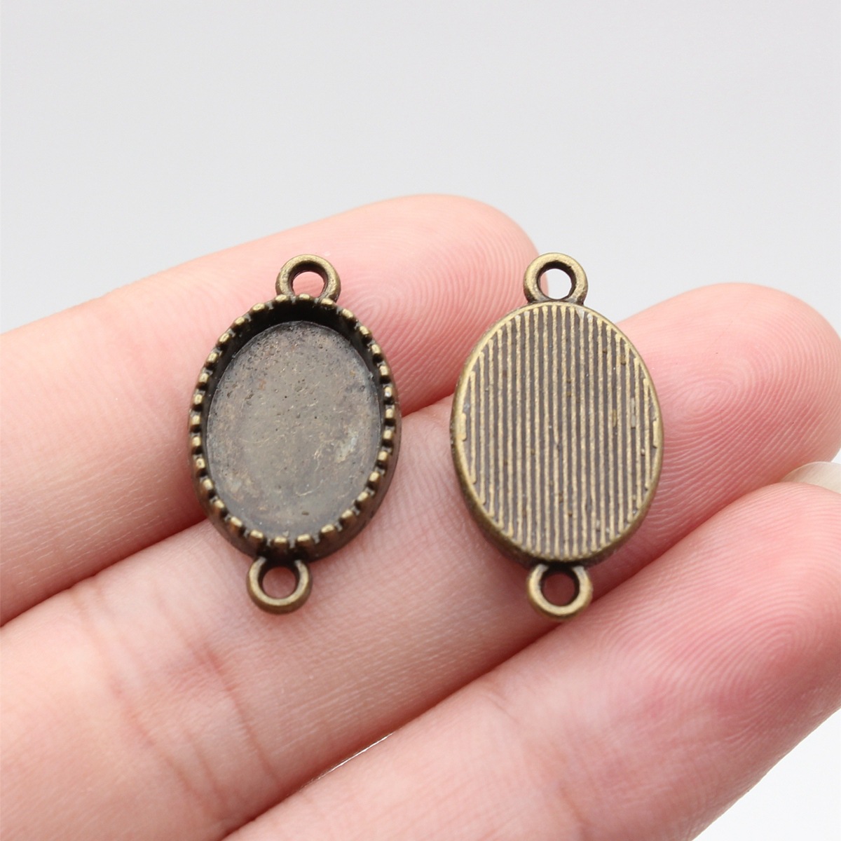 Outer diameter: 23x13mm Inner diameter: 10x14mm -