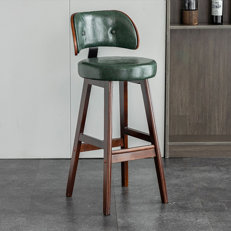 brown solid wood feet   dark green leather