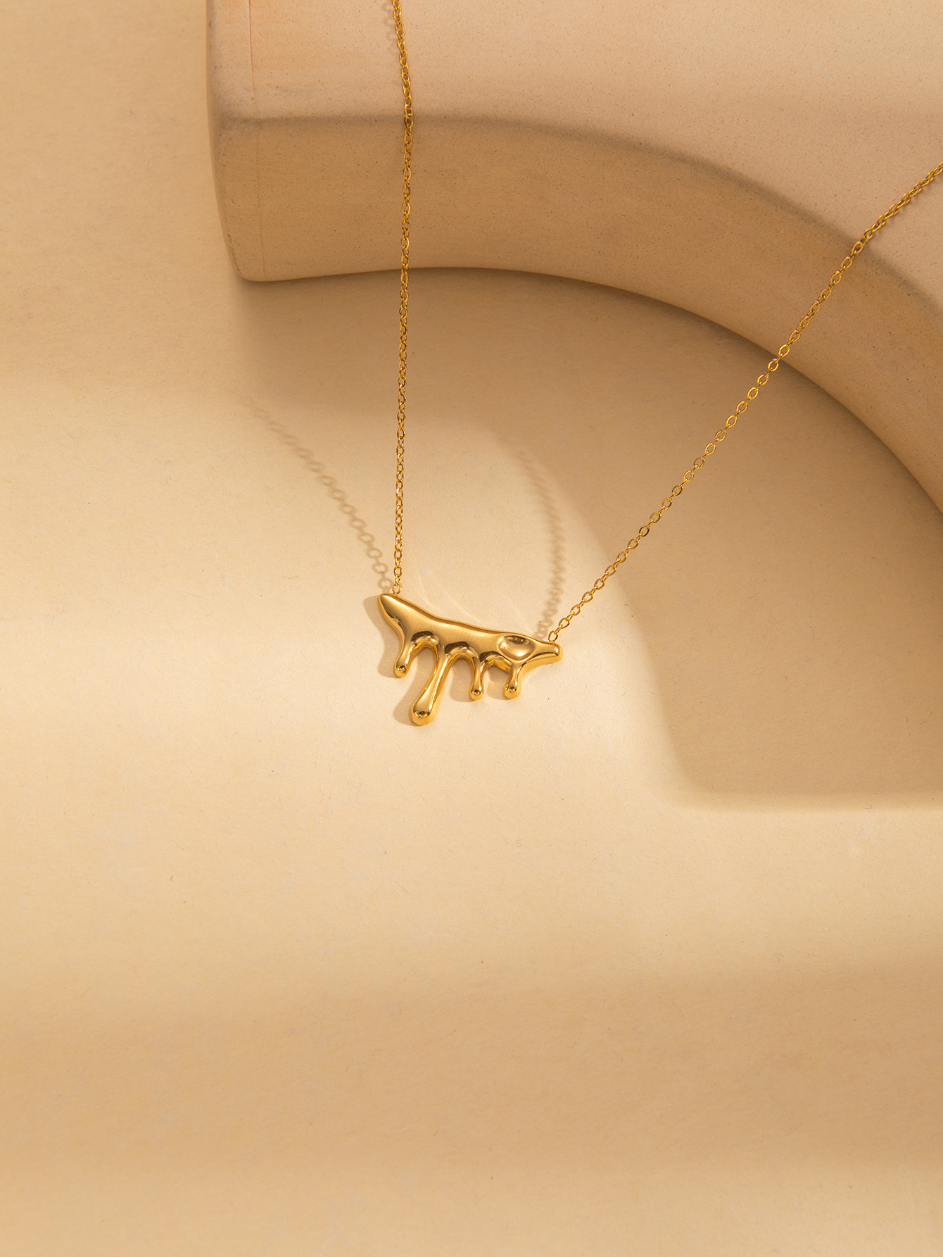 8:Gold drop necklace