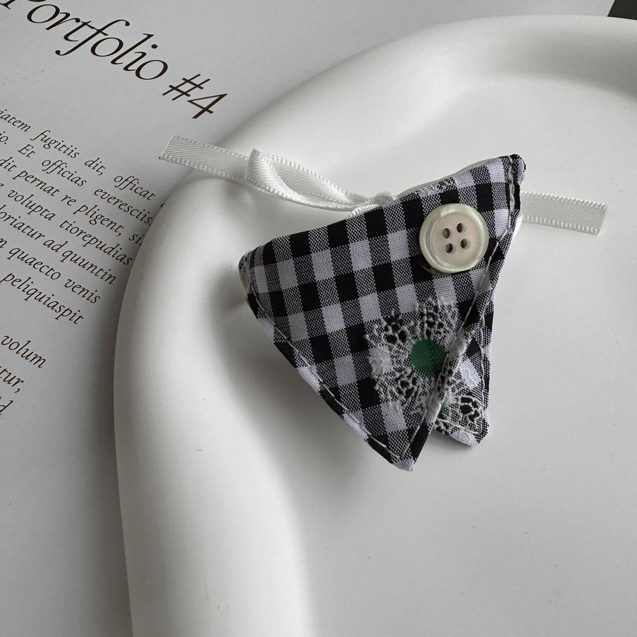 Black Button Check Bib