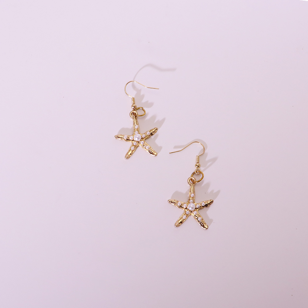 3:Gold starfish earrings