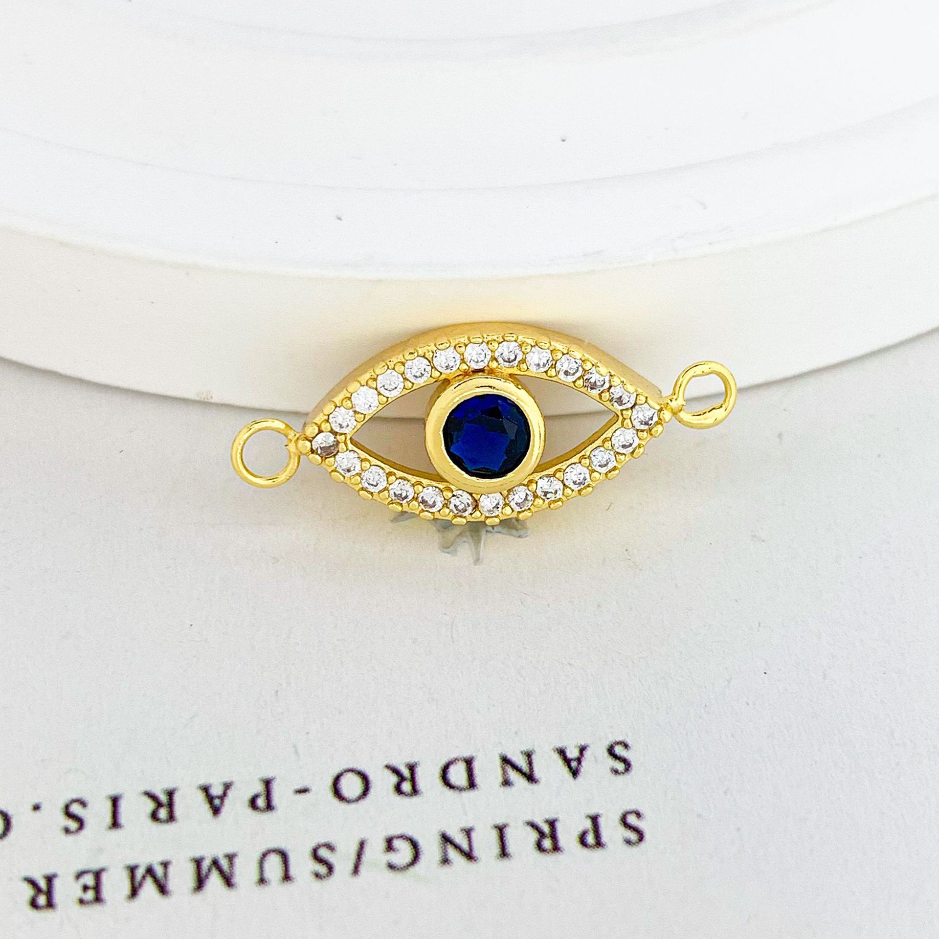 11:Sl667 hollow blue eyes pendant gold