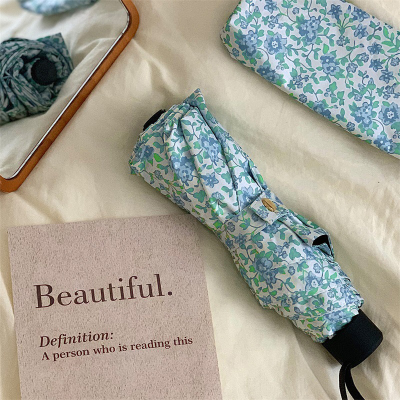 Green floral three fold black handle