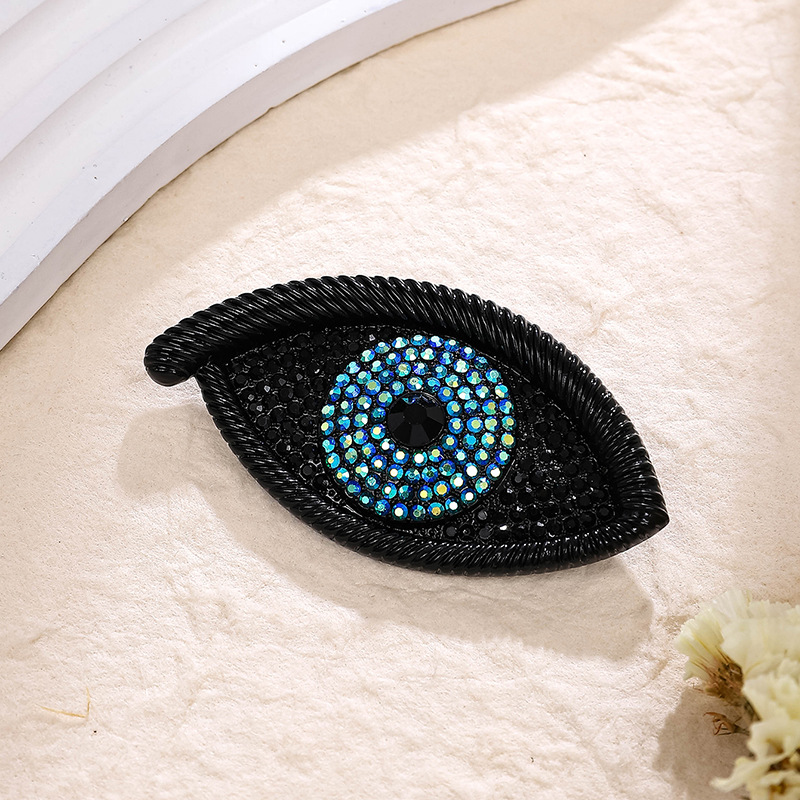 2:Black full diamond eye brooch