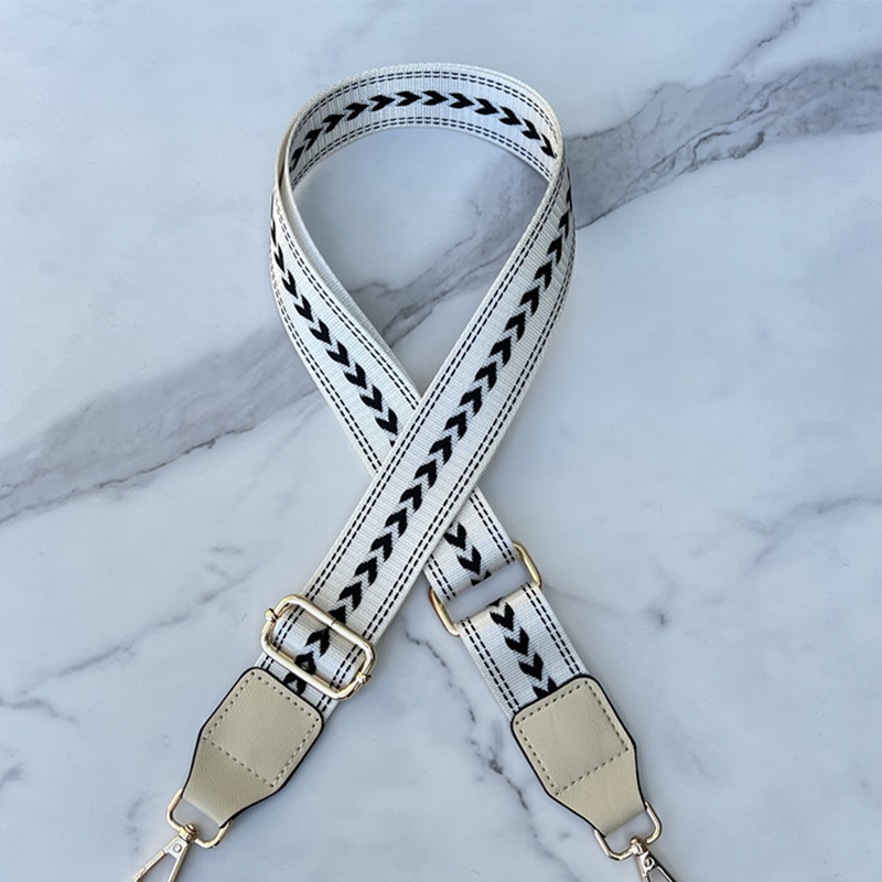 Beige white background black small arrow-beige white leather