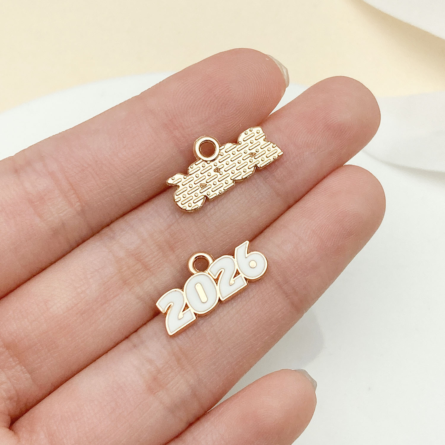 11:23345-1 kc gold white dripping zinc alloy 2026 number plate 9x17mm-0.5g