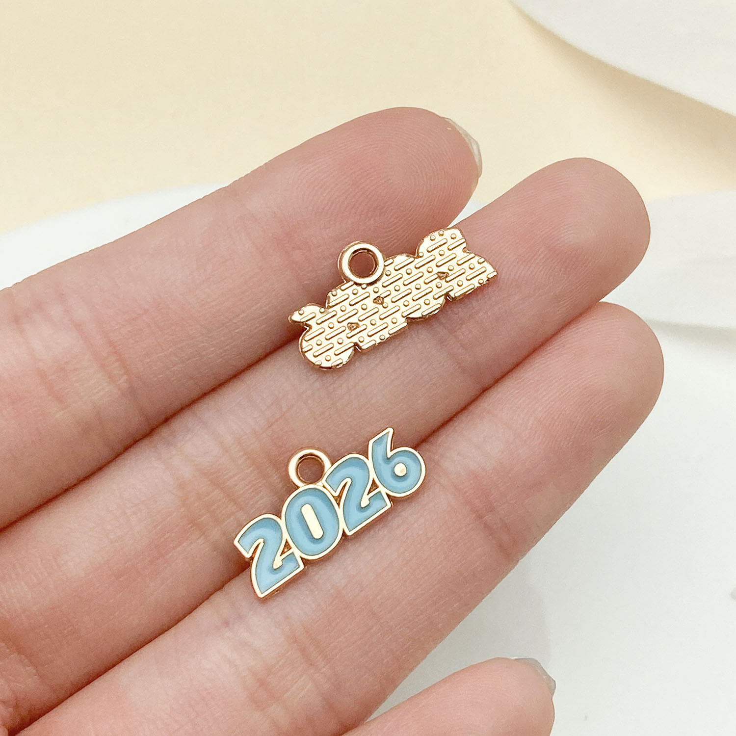 15:23349-1 kc gold blue dripping zinc alloy 2026 number plate 9x17mm-0.5g