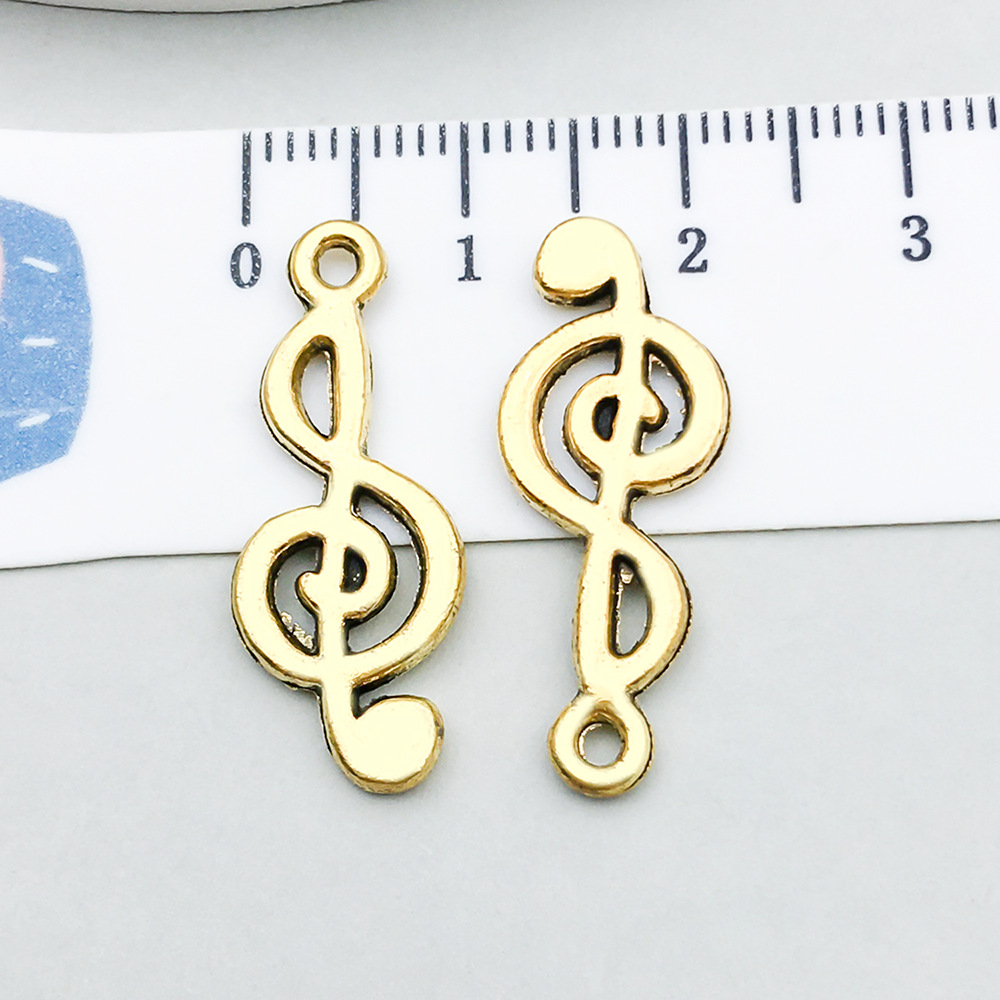 2:1 ancient gold music symbol 25*10mm