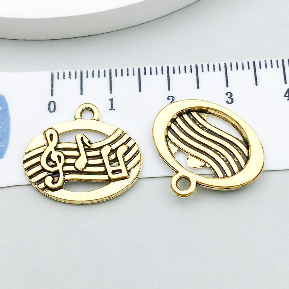5:1 ancient gold music symbol 17*19mm