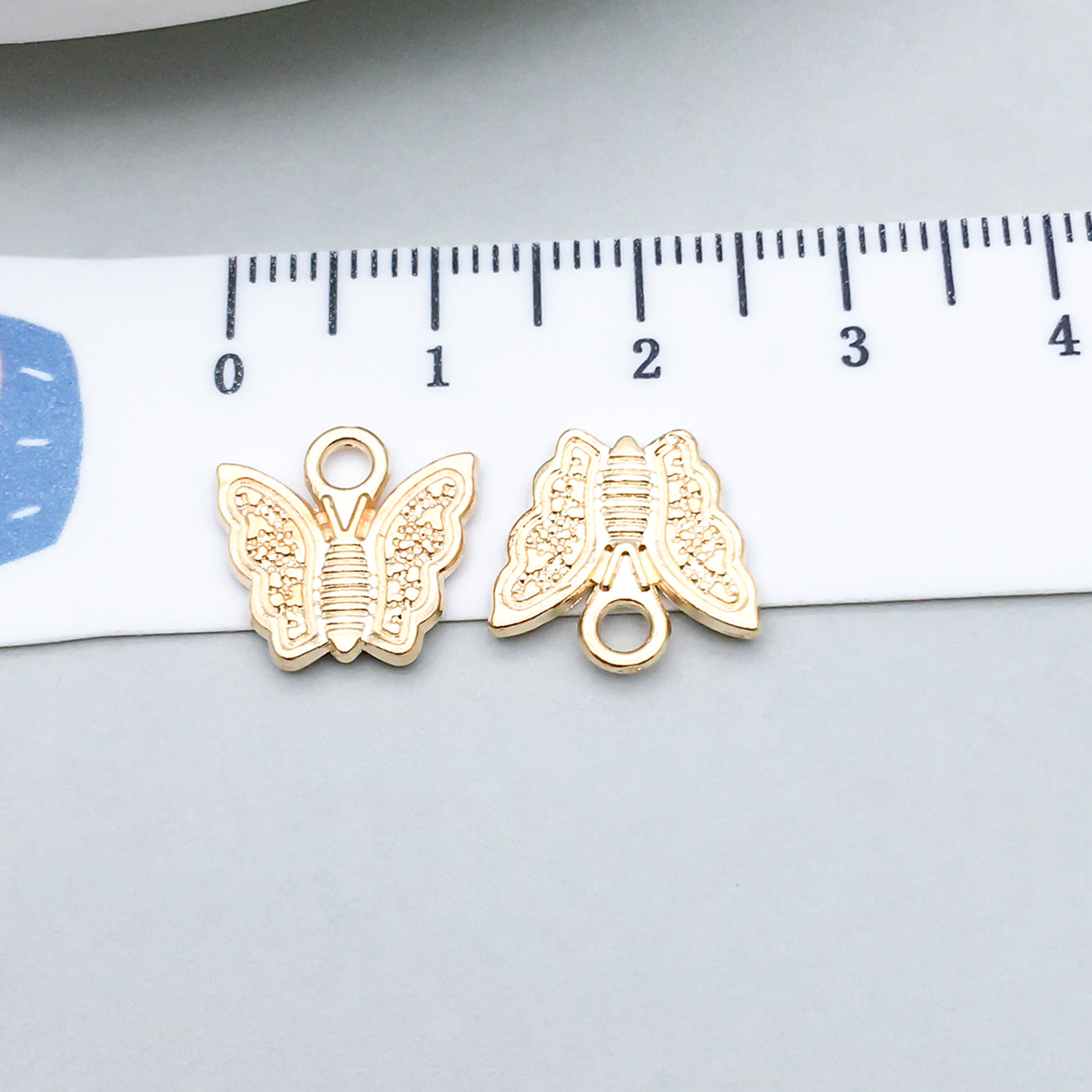 2:1 kc gold butterfly 13*12mm-0.9g-11612