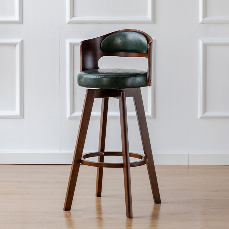 Brown wooden feet   dark green leather