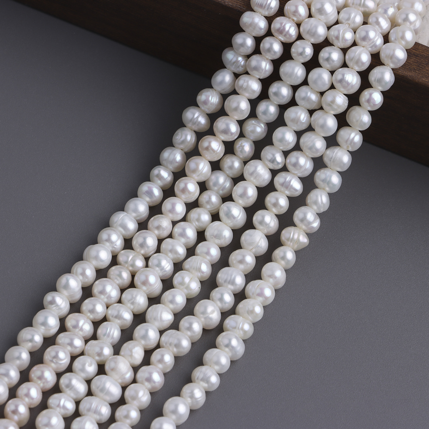 1:White 5-6mm threaded nearly round beads, one string