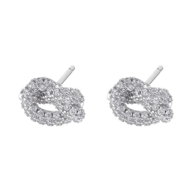 2:1 pair of white gold white diamond alkaline water knot earrings
