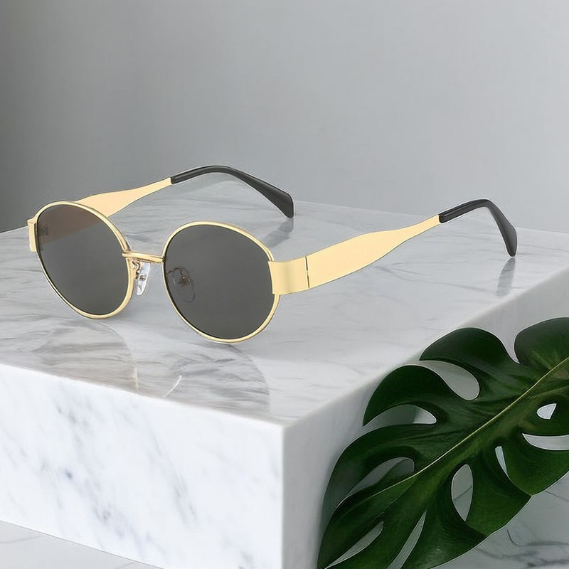 Gold frame, grey lens