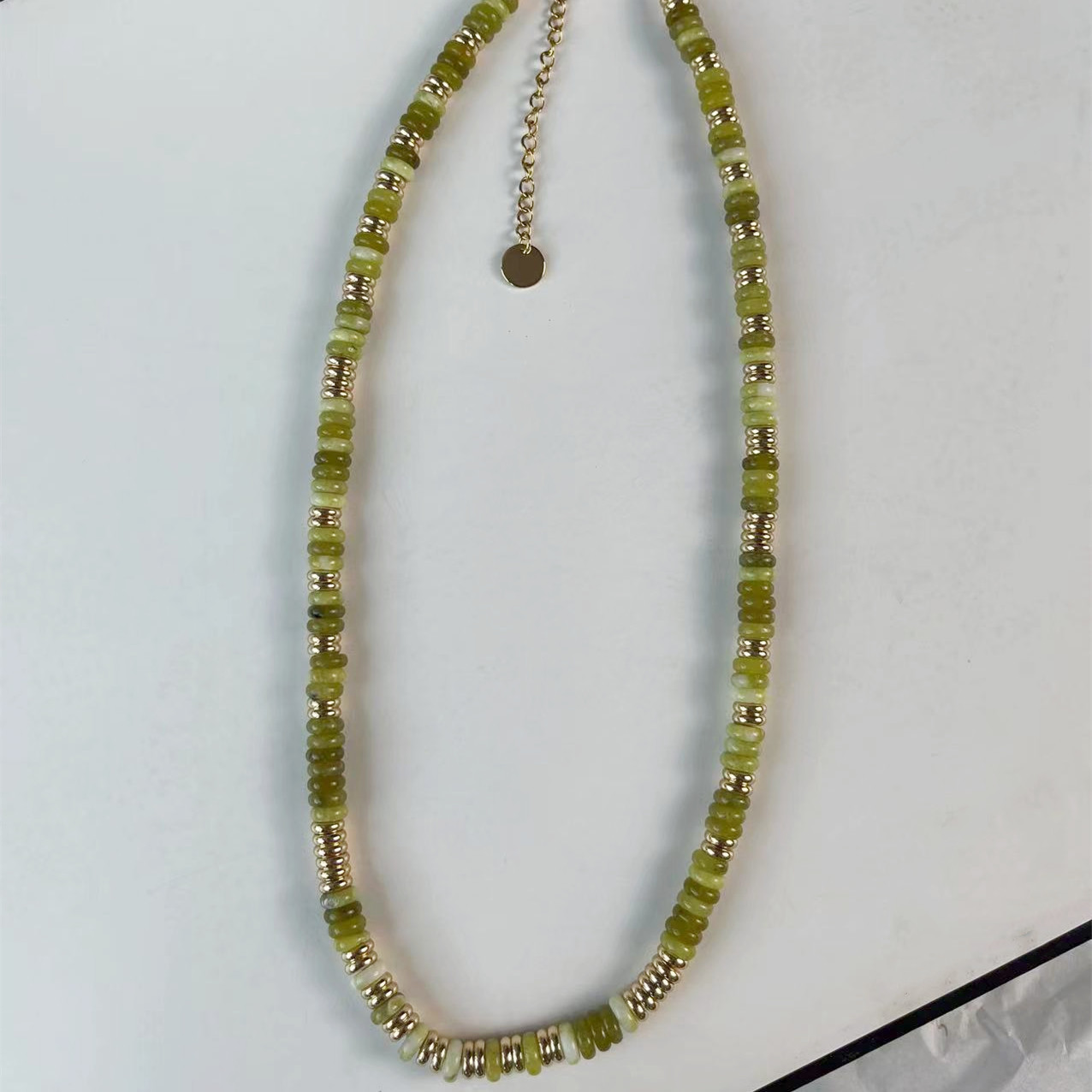 8 Emerald Stone Frisbee Necklace