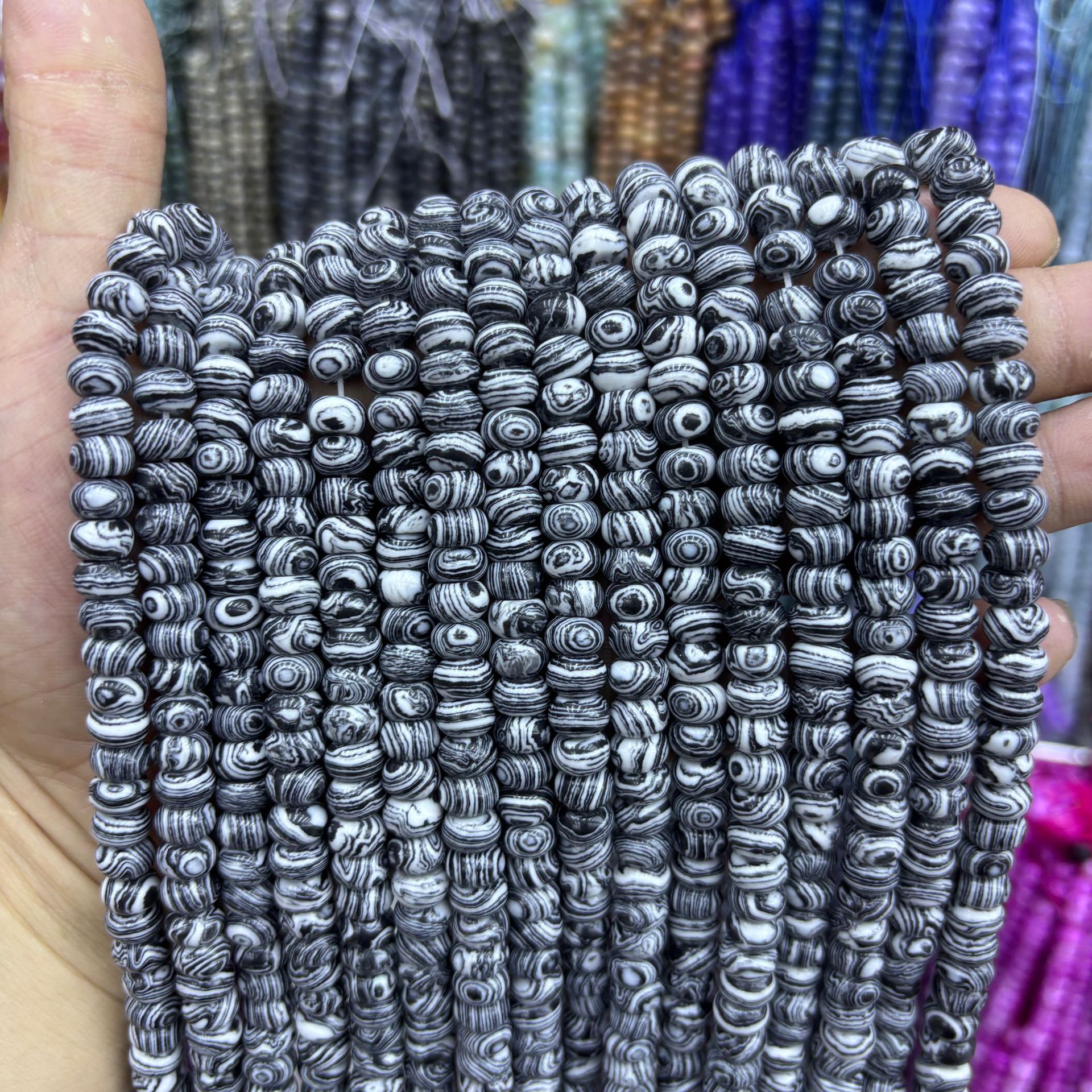 82:Synthetic black and white peacock abacus beads