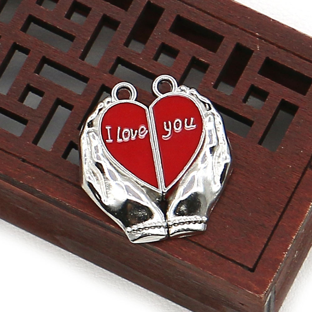 17:015 silver hand holding red heart 25x27mm, 6g