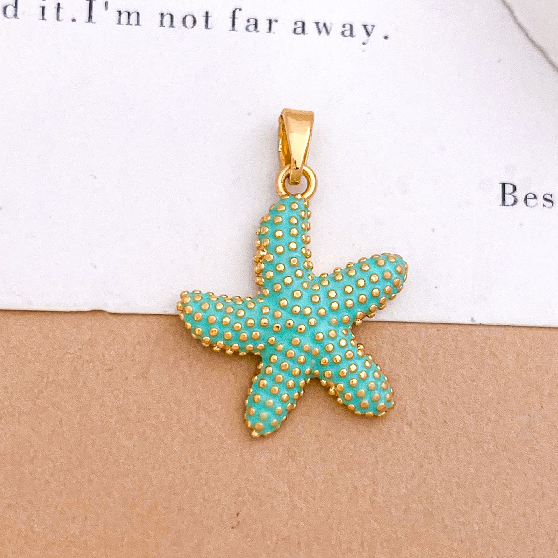 2:Xl4120 dancing starfish pendant gold light blue
