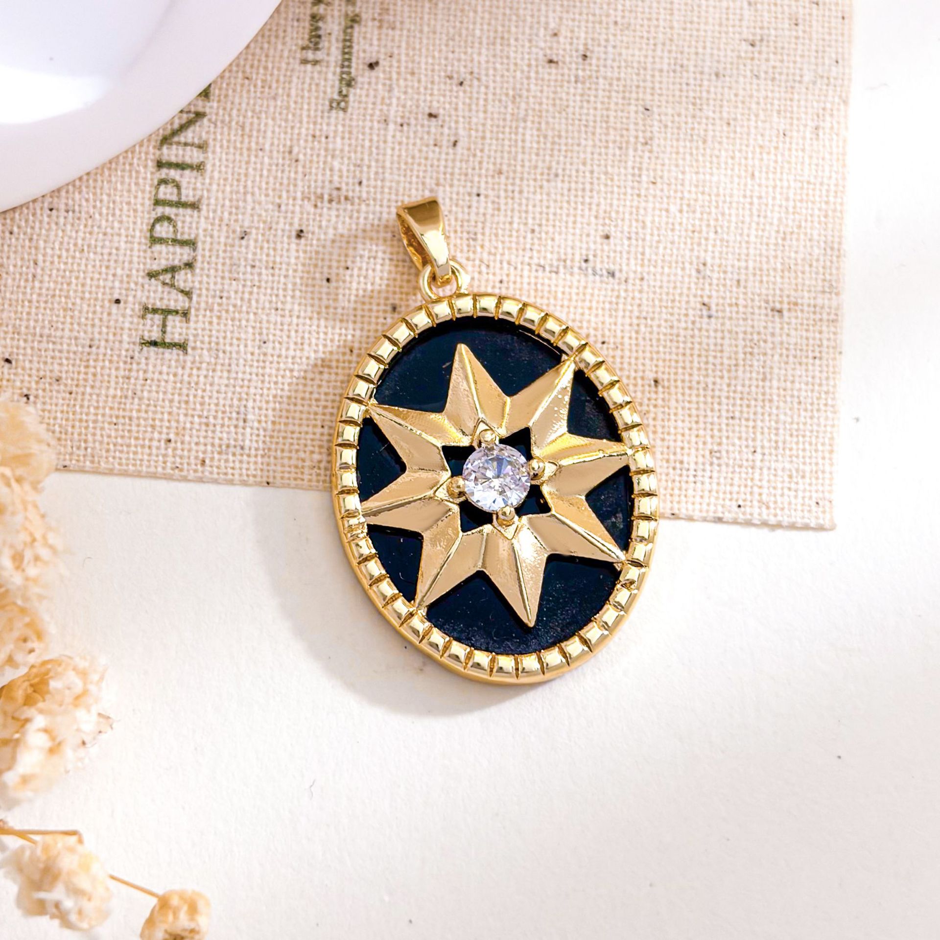 Xl5647 oval eight-pointed star pendant gold black