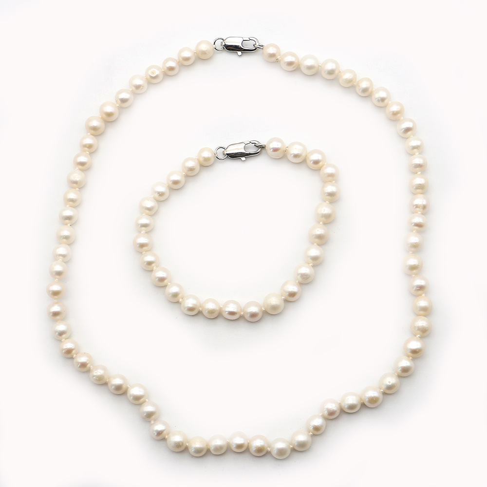 6:045 nearly round bead 7-8mm (lobster clasp) necklace 42cm; bracelet 18cm