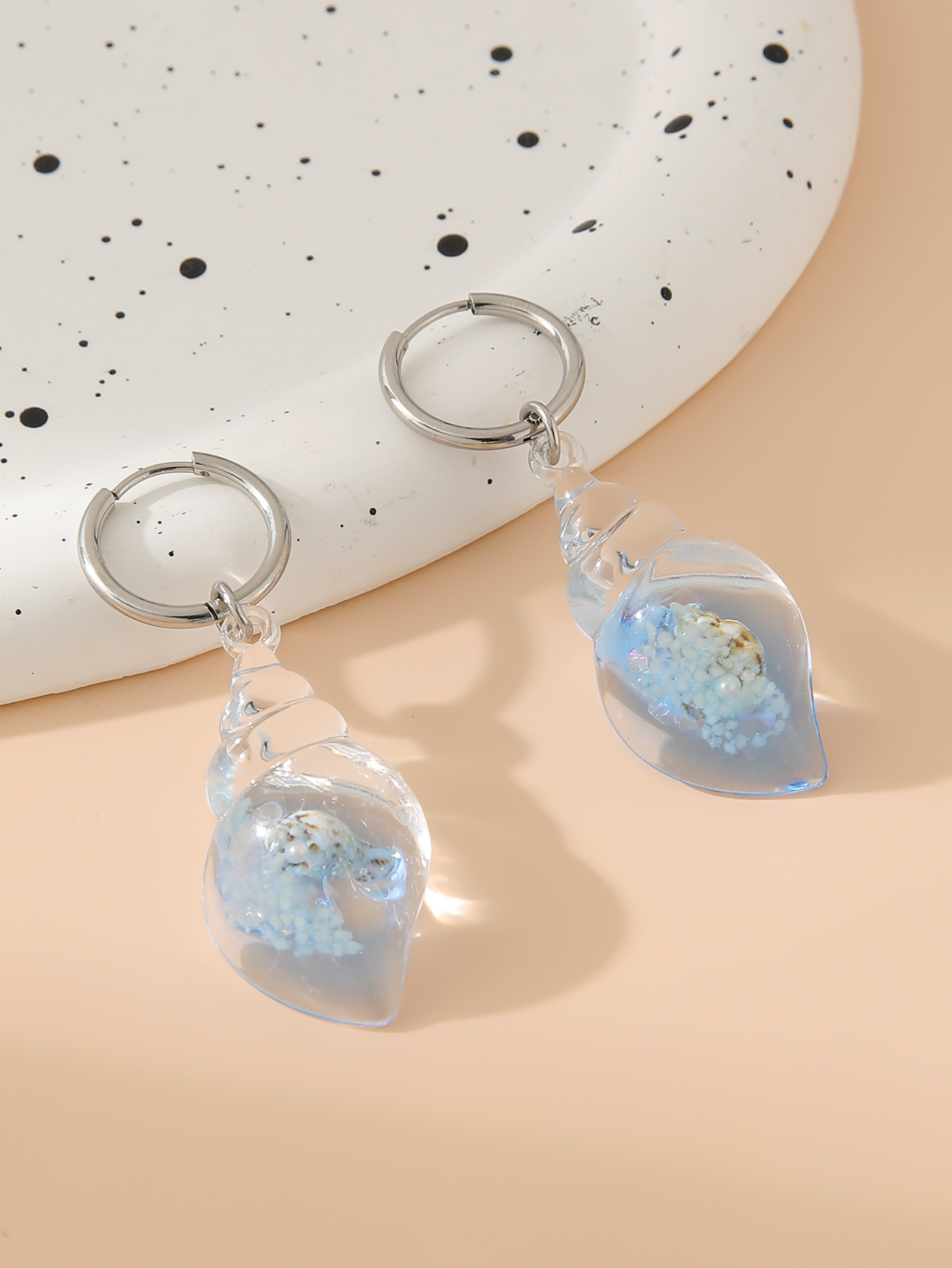 Conch earrings light blue pair