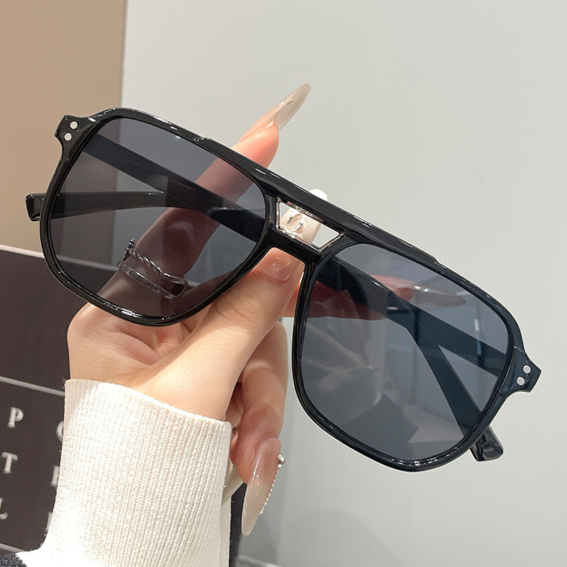 Black frame, grey lens