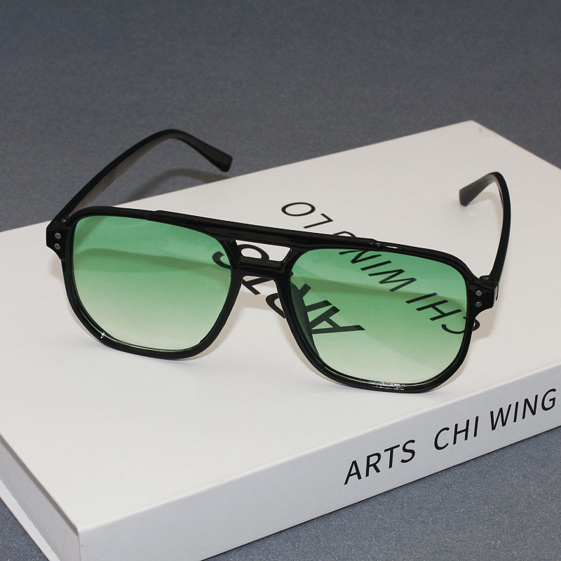 Black frame, green lens