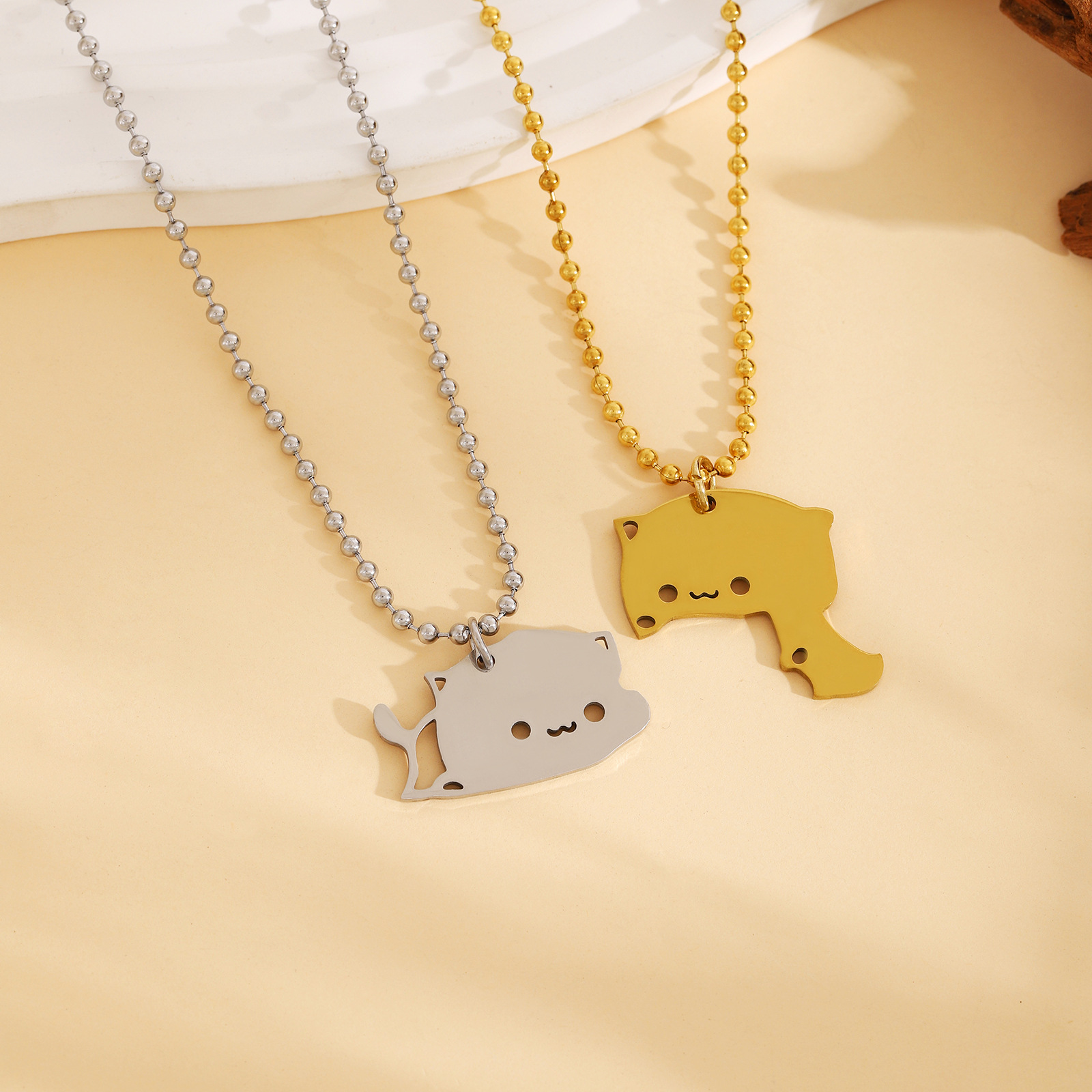 3:1 pair of cuddle cat necklace gold and silver